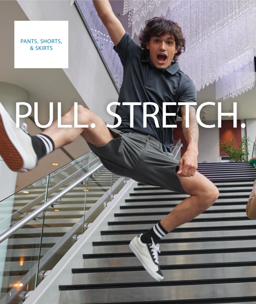 Man jumping on a staircase in grey Edwards shorts and a dark polo, Pull. Stretch.